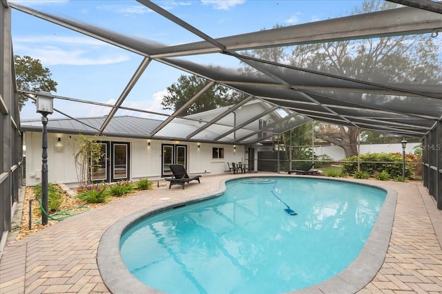 view of pool with a lanai and a patio