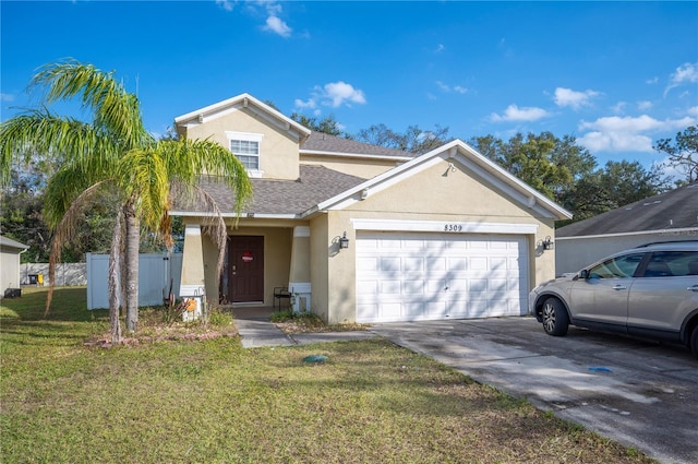 view of front property with a front lawn and a garage