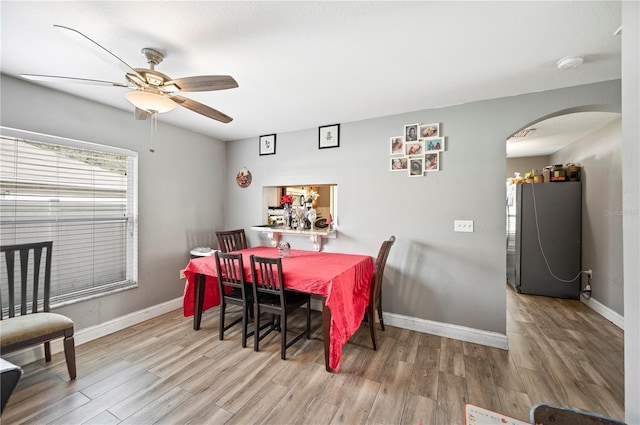 dining area featuring ceiling fan and wood-type flooring