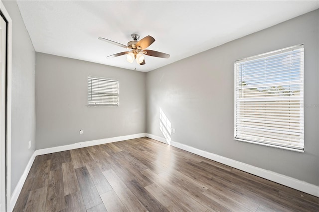 empty room featuring hardwood / wood-style floors and ceiling fan