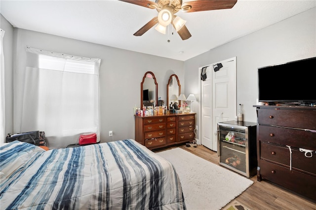 bedroom with ceiling fan and light hardwood / wood-style floors