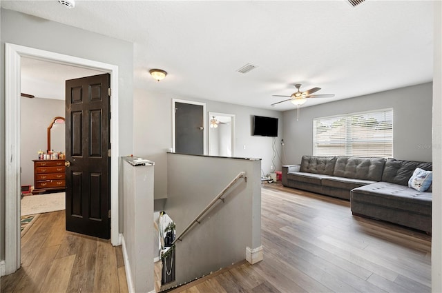 interior space featuring ceiling fan and light hardwood / wood-style flooring