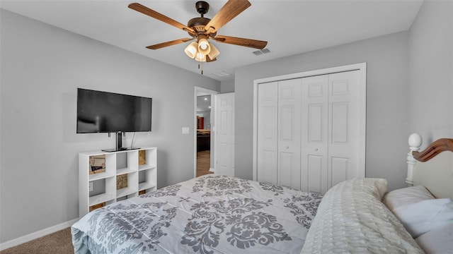 bedroom featuring ceiling fan, a closet, and carpet floors