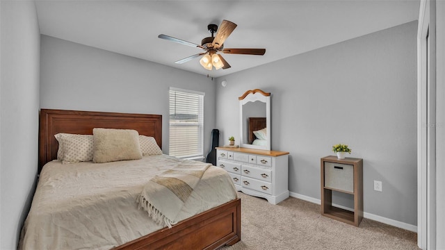 bedroom with light carpet and ceiling fan