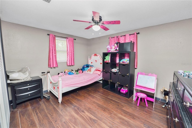 bedroom featuring ceiling fan and dark wood-type flooring