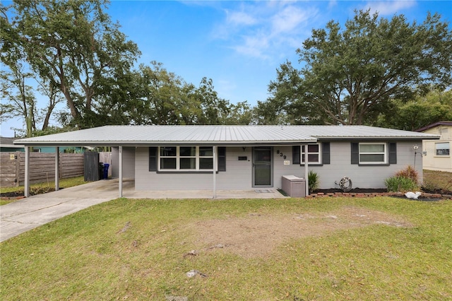 ranch-style house with a front lawn and a carport