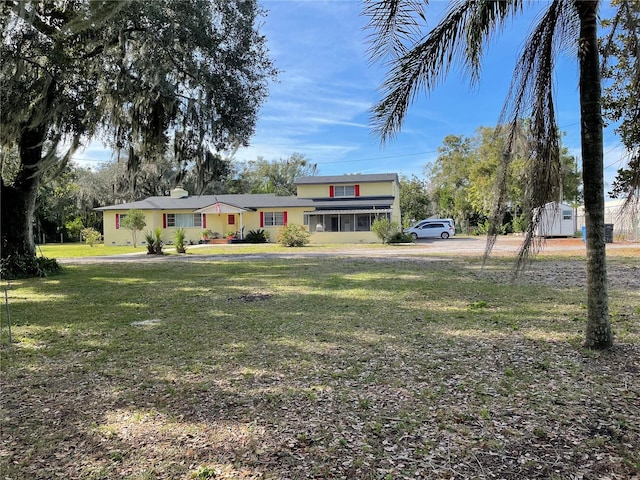 view of front of home with a front lawn