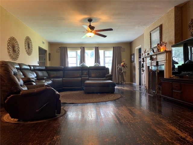 living room with ceiling fan and dark hardwood / wood-style floors