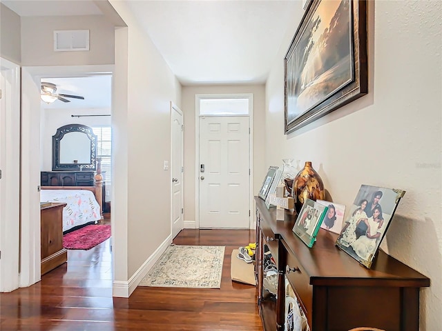 foyer with ceiling fan and dark hardwood / wood-style floors