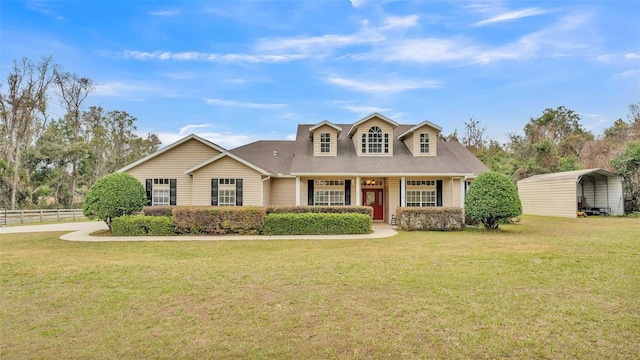 view of front of home featuring a front yard and a carport