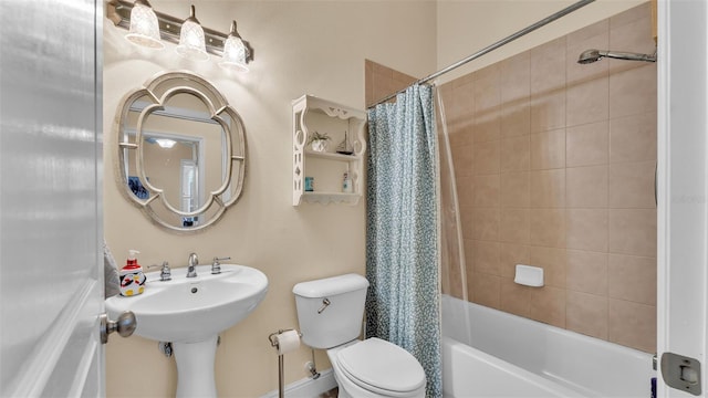 bathroom with shower / tub combo with curtain and toilet