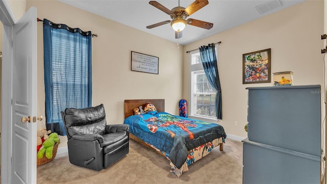 bedroom featuring ceiling fan and light carpet