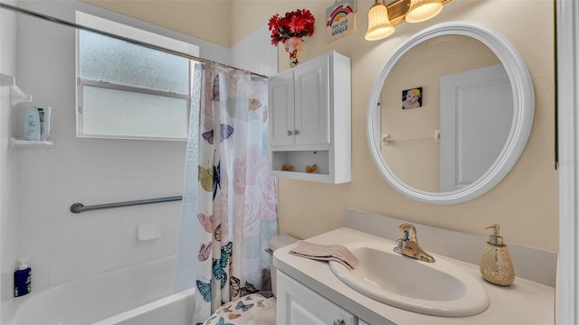 bathroom featuring vanity and shower / bathtub combination with curtain