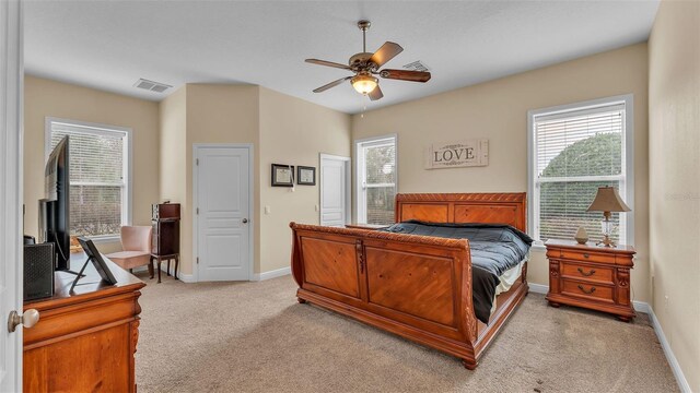 bedroom featuring light colored carpet and ceiling fan