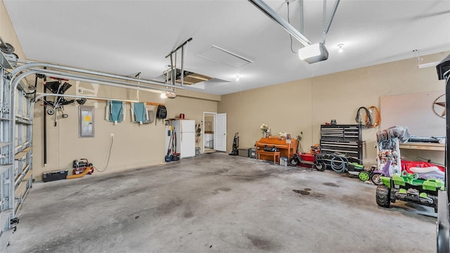 garage featuring a garage door opener and electric panel