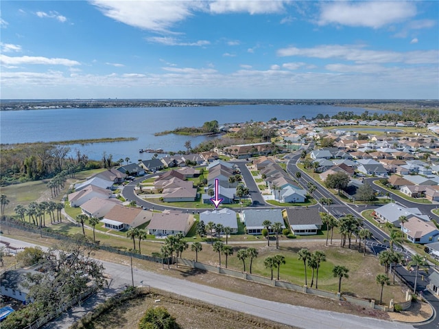 bird's eye view with a water view and a residential view