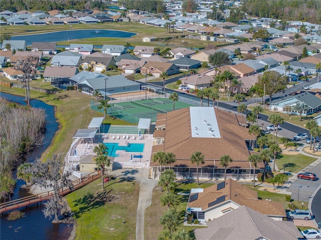 birds eye view of property featuring a water view and a residential view