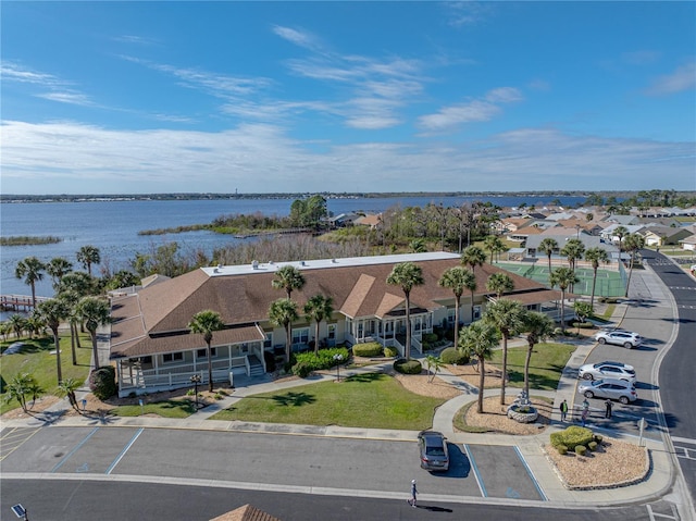 bird's eye view with a water view and a residential view