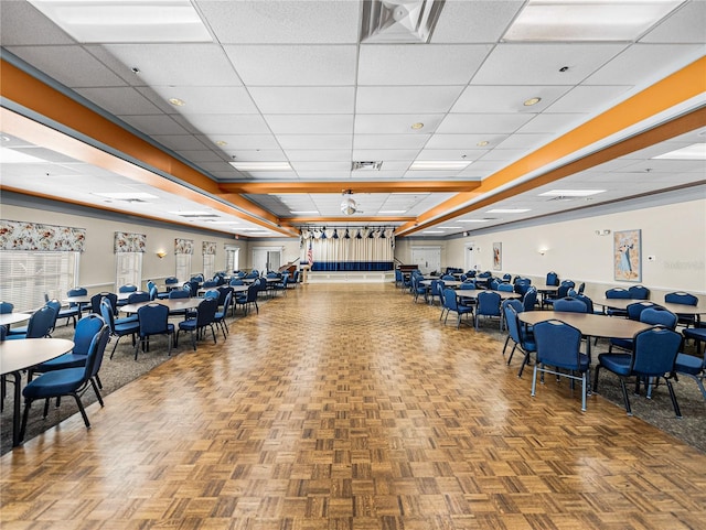 interior space featuring visible vents and a drop ceiling