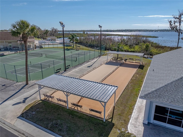 birds eye view of property with a water view