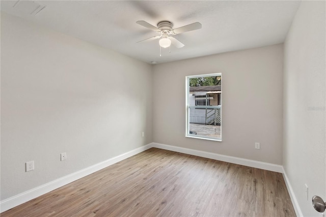 spare room with ceiling fan and light hardwood / wood-style floors