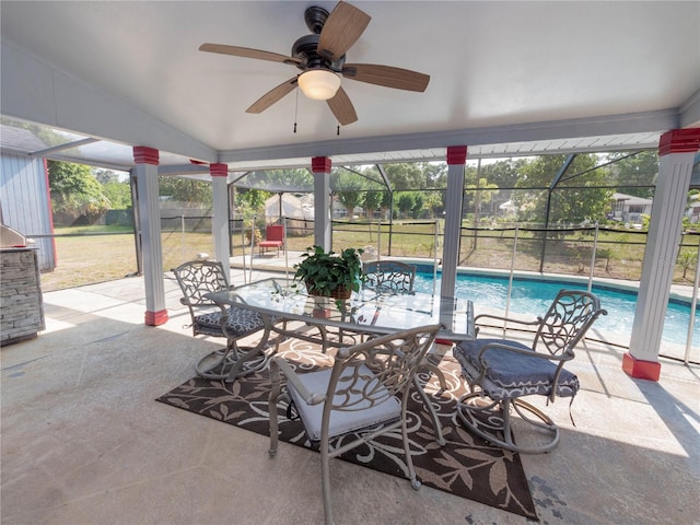 view of patio / terrace with ceiling fan and glass enclosure