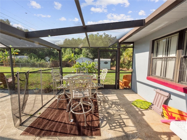 view of patio / terrace featuring glass enclosure