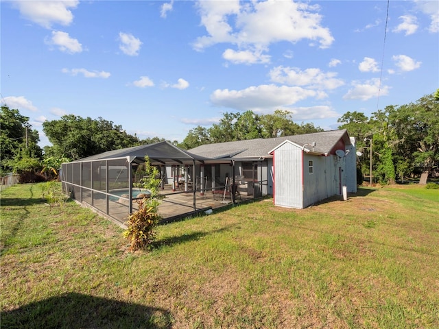 back of property featuring a patio, a lanai, and a yard