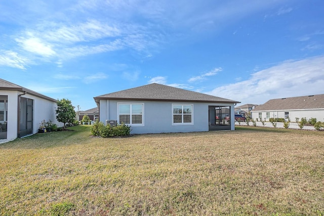 rear view of house with a lawn