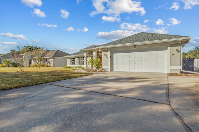 single story home featuring a front lawn and a garage