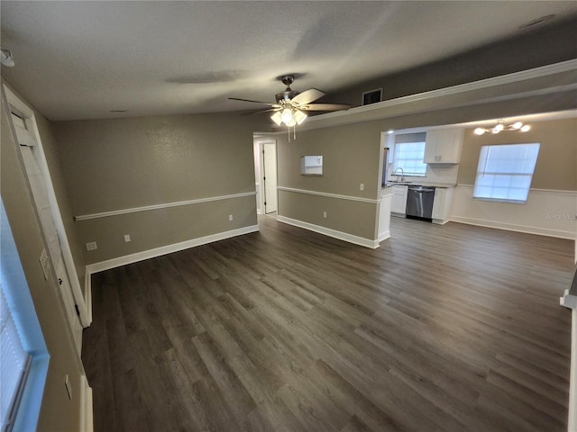 unfurnished living room featuring a sink, visible vents, dark wood-style flooring, and ceiling fan with notable chandelier