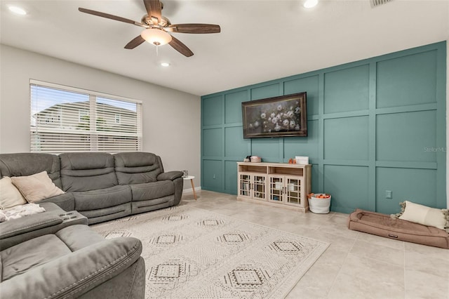 tiled living room featuring ceiling fan