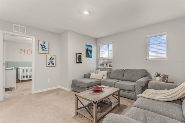 living room featuring light carpet