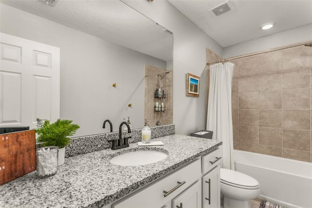 full bathroom with shower / bathtub combination with curtain, a textured ceiling, vanity, and toilet