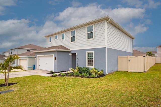 view of front of house with a garage and a front lawn