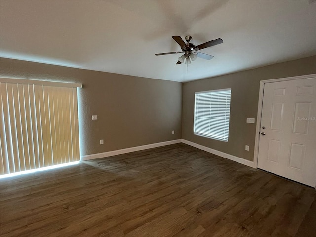 foyer entrance with ceiling fan and dark hardwood / wood-style flooring