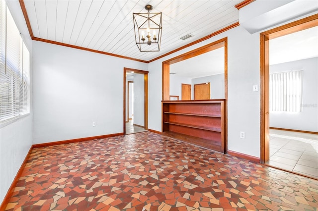 empty room with ornamental molding, a notable chandelier, and wood ceiling