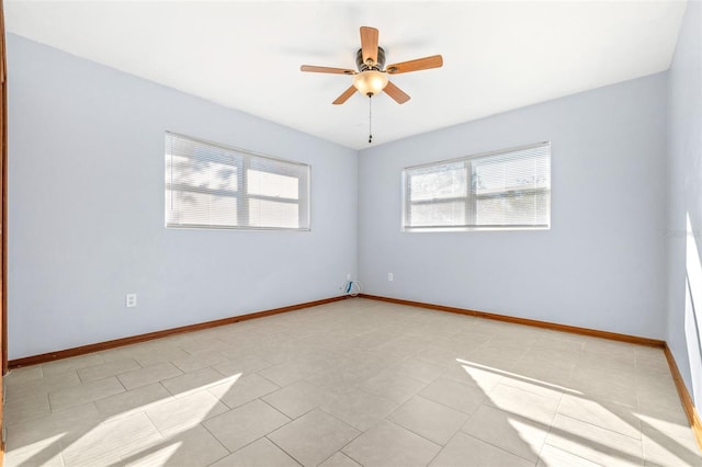 unfurnished room featuring light tile patterned flooring and ceiling fan