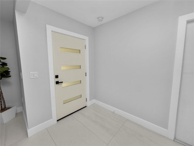 doorway to outside featuring light tile patterned floors