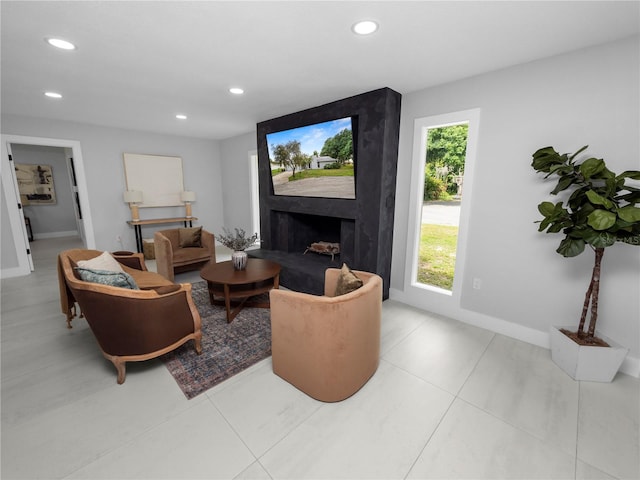 living room featuring a fireplace