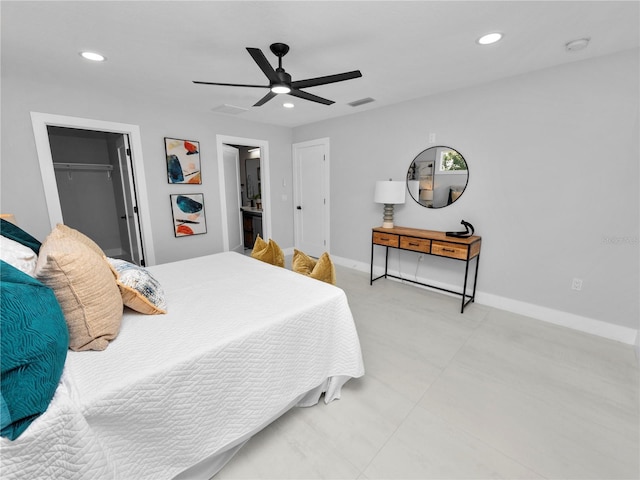 bedroom with ceiling fan, a spacious closet, and a closet