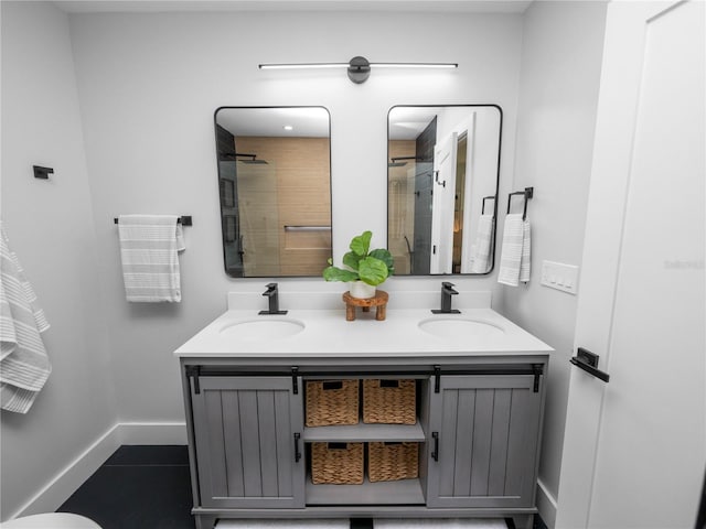 bathroom featuring a shower, tile patterned floors, and vanity