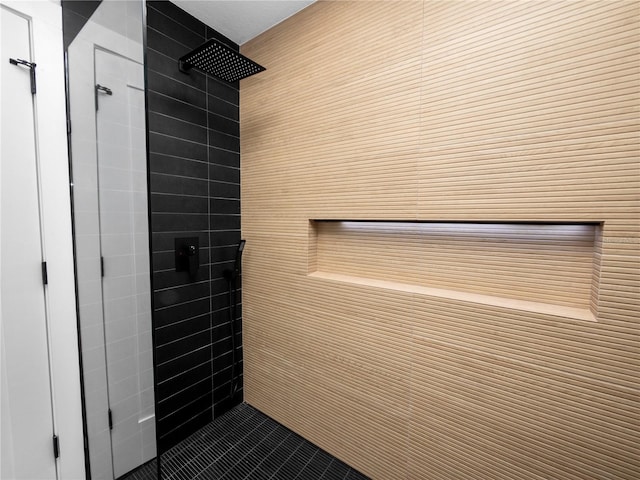 bathroom with a tile shower