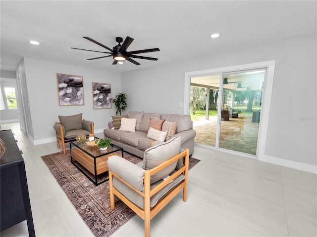 living room with ceiling fan and light tile patterned floors