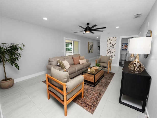 living room featuring ceiling fan and light tile patterned floors