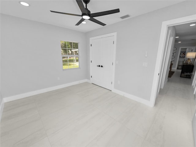 unfurnished room featuring ceiling fan