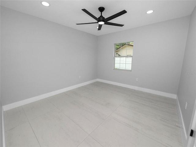 tiled empty room with ceiling fan