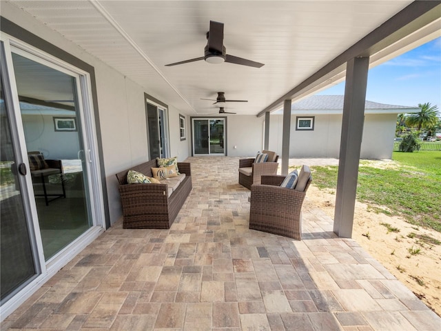 view of patio / terrace featuring ceiling fan and an outdoor living space