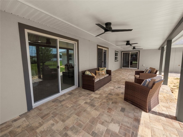 view of patio with ceiling fan and outdoor lounge area