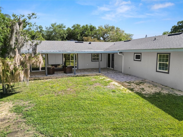 back of house with a patio area, outdoor lounge area, and a yard